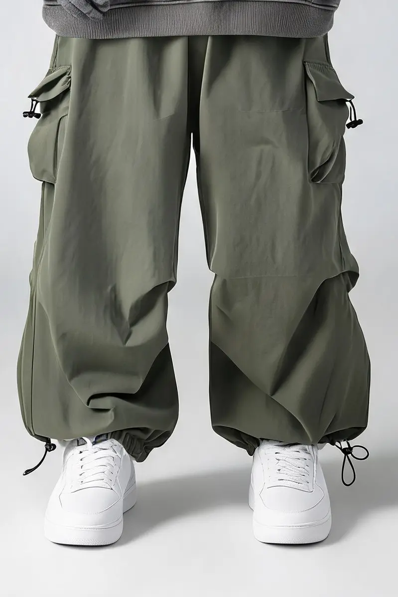 Illustration of the Susclude baggy parachute cargo pants, gray-green